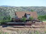 Long view of house with onground pool. The onground pool is located on the left hand side of the picture.