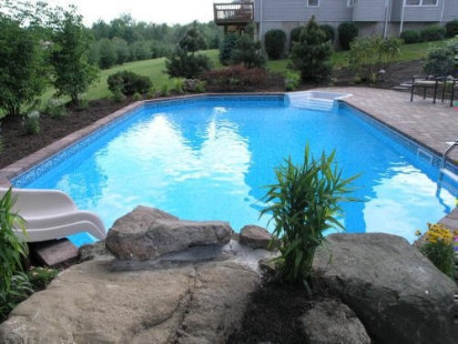 Champlain On Ground Pool installed in a sloping yard